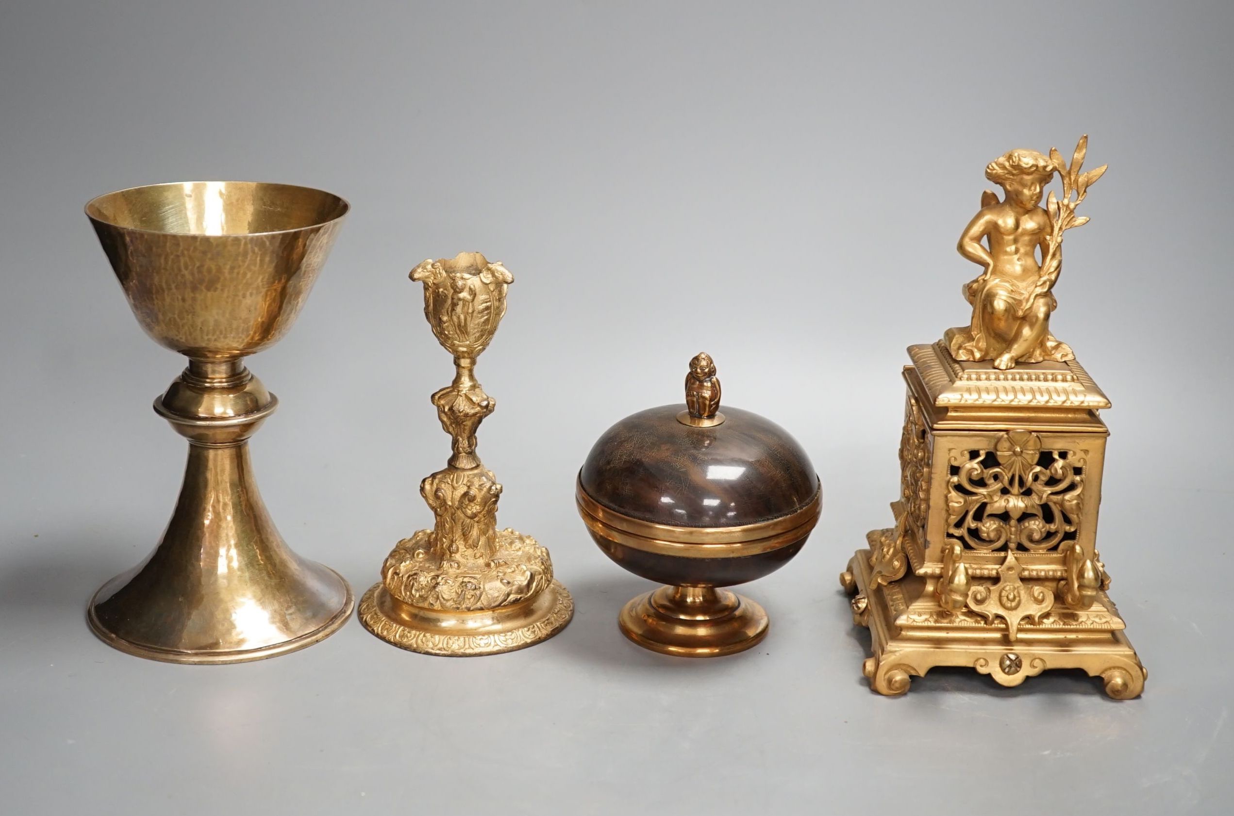 A decorative ormolu inkwell, 20cm high, a Baroque style candlestick, a chalice stamped W IV, together with a faux tortoiseshell pot (4)